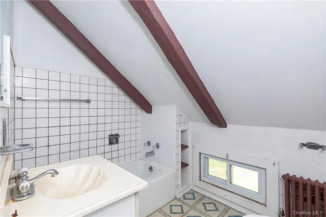 a bathroom with a sink and a bathtub