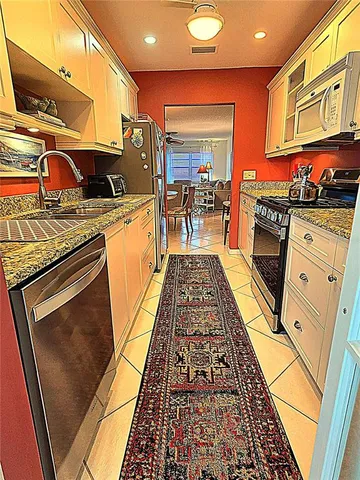 a kitchen with a sink and a stove