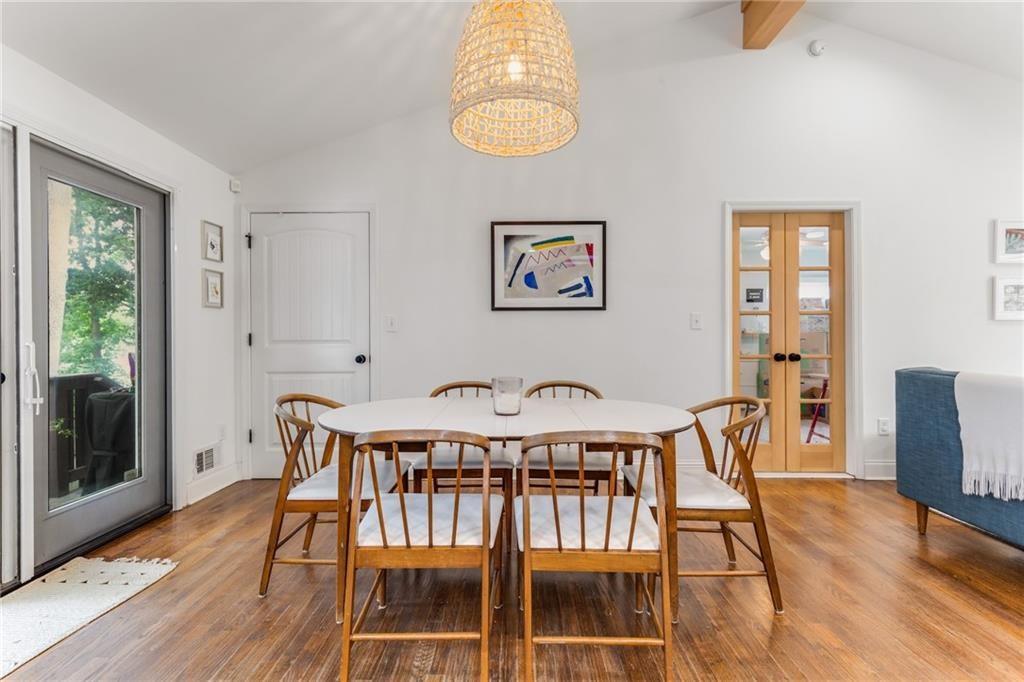 2357 Cortez Way Northeast Brookhaven, GA 30319 - Photo 11 of 32 a view of a dining room with furniture window and wooden floor