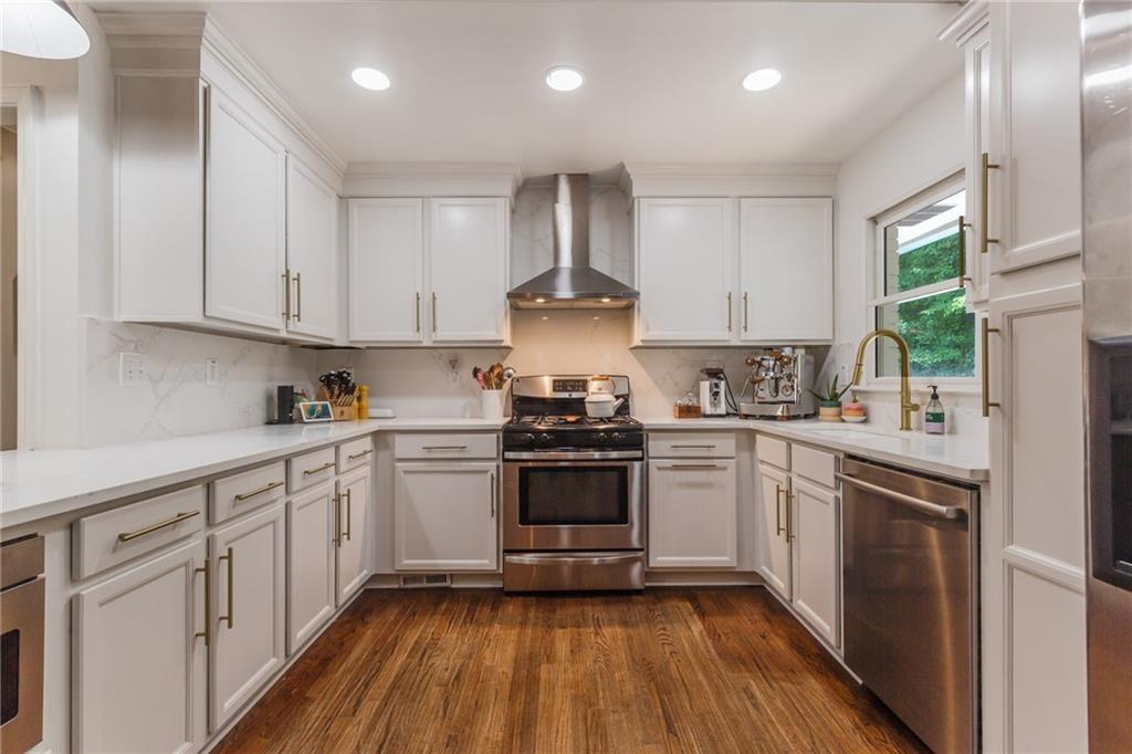 2357 Cortez Way Northeast Brookhaven, GA 30319 - Photo 13 of 32 a kitchen with a sink stove and cabinets