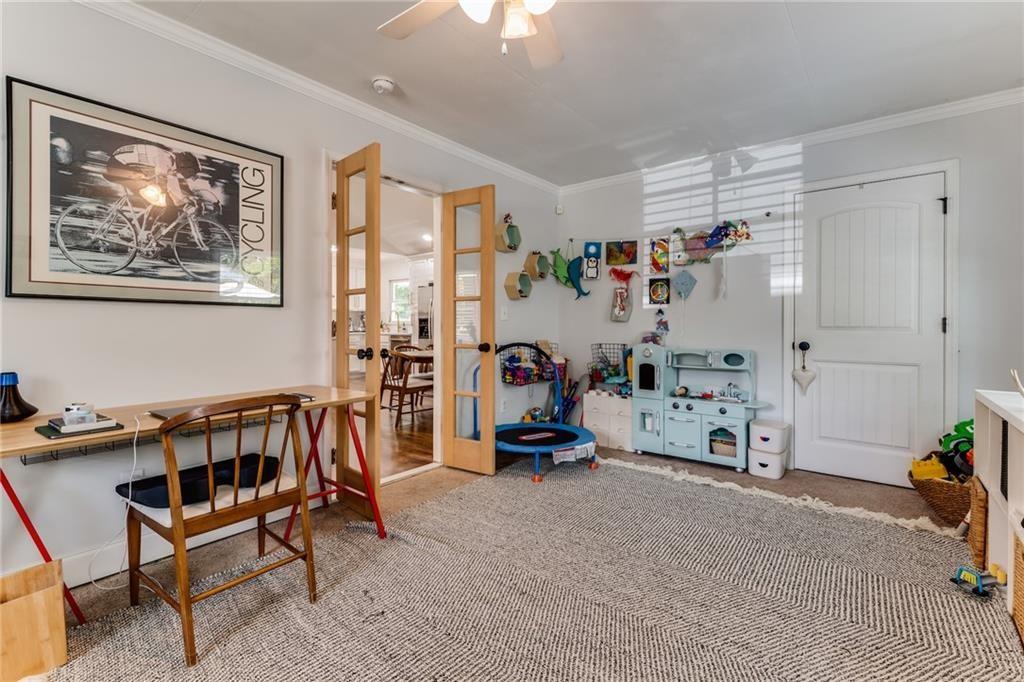 2357 Cortez Way Northeast Brookhaven, GA 30319 - Photo 15 of 32 a view of a workspace with furniture and a livingroom