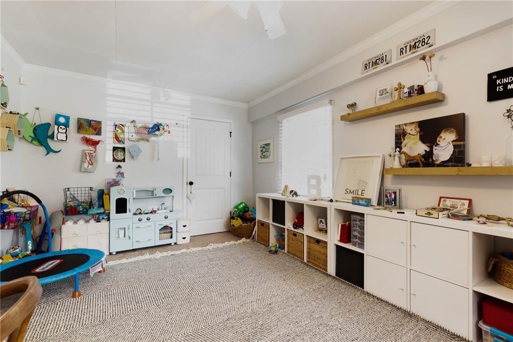 2357 Cortez Way Northeast Brookhaven, GA 30319 - Photo 16 of 32 a view of a bedroom with baby toys