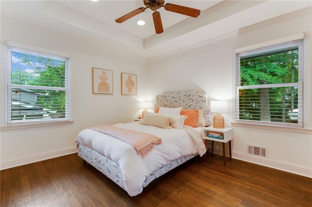 2357 Cortez Way Northeast Brookhaven, GA 30319 - Photo 17 of 32 a bedroom with a bed chandelier and window