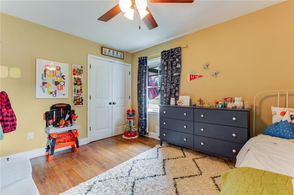 2357 Cortez Way Northeast Brookhaven, GA 30319 - Photo 21 of 32 a bed room with a bed and a couch