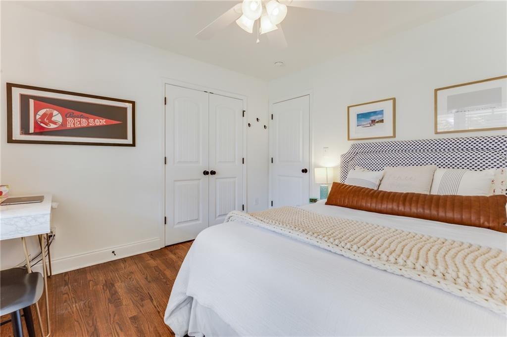 2357 Cortez Way Northeast Brookhaven, GA 30319 - Photo 24 of 32 a bedroom with a bed and a chandelier