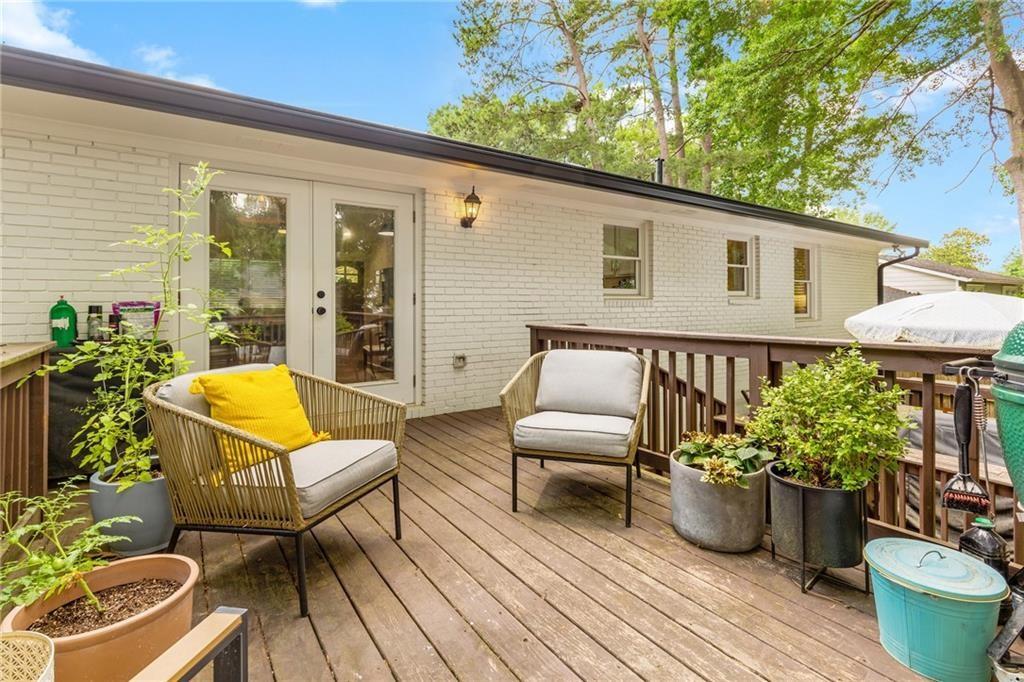 2357 Cortez Way Northeast Brookhaven, GA 30319 - Photo 27 of 32 a outdoor living space with furniture potted plant and wooden floor