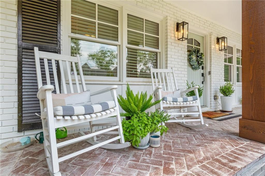 2357 Cortez Way Northeast Brookhaven, GA 30319 - Photo 4 of 32 a view of a balcony with chairs potted plants