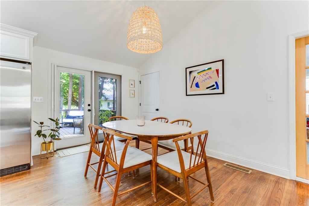 2357 Cortez Way Northeast Brookhaven, GA 30319 - Photo 9 of 32 a view of a dining room with furniture and a chandelier