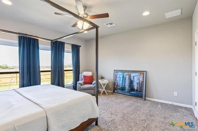 a bed room with a bed and a window