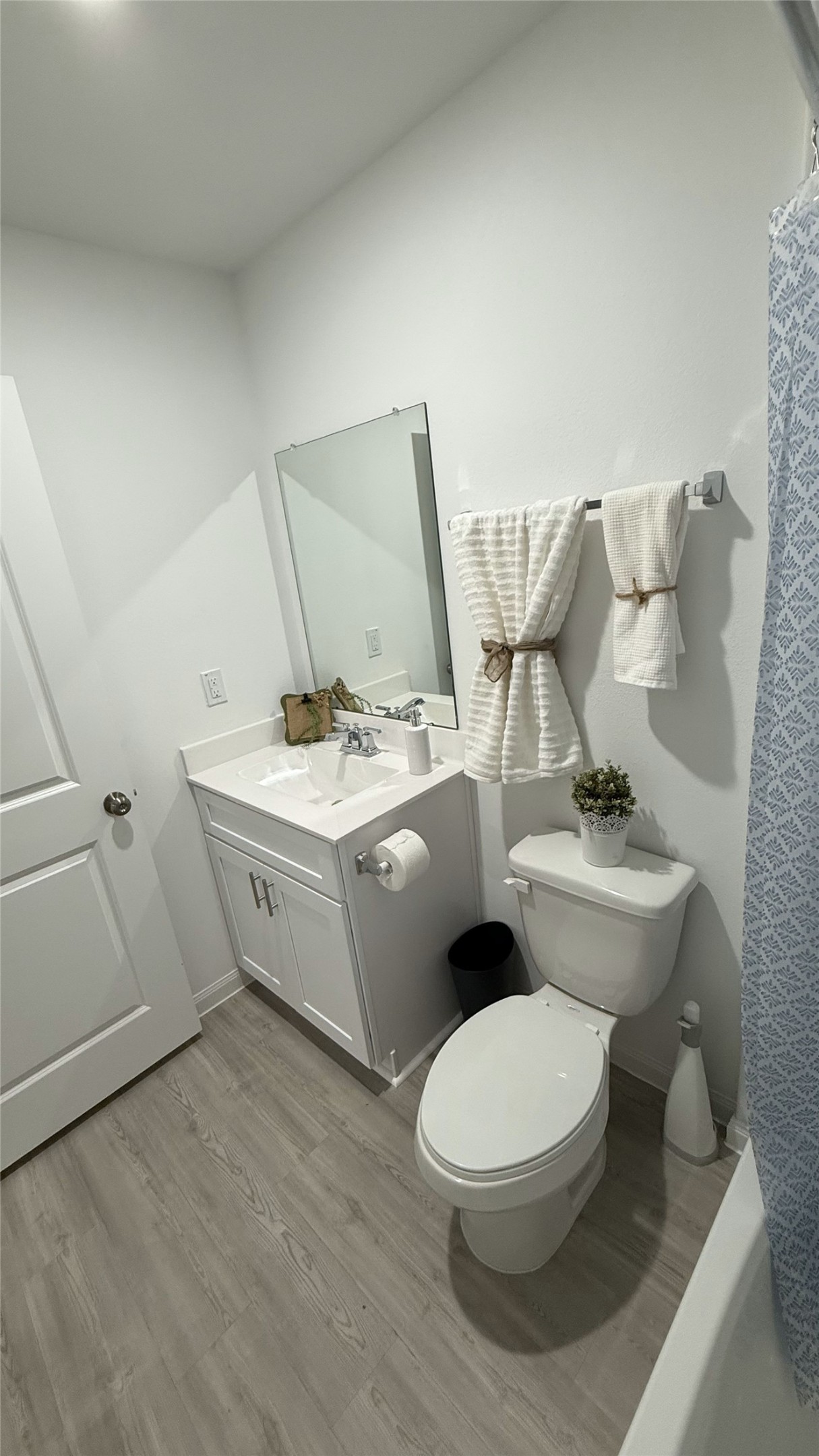 23406 Wagon Cart Road Hockley, TX 77447 - Photo 25 of 47 a white toilet sitting next to a white sink and vanity