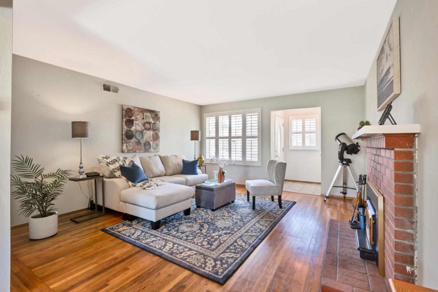 16 North Rochester Street San Mateo, CA 94401 - Photo 11 of 27 a living room with furniture and a wooden floor