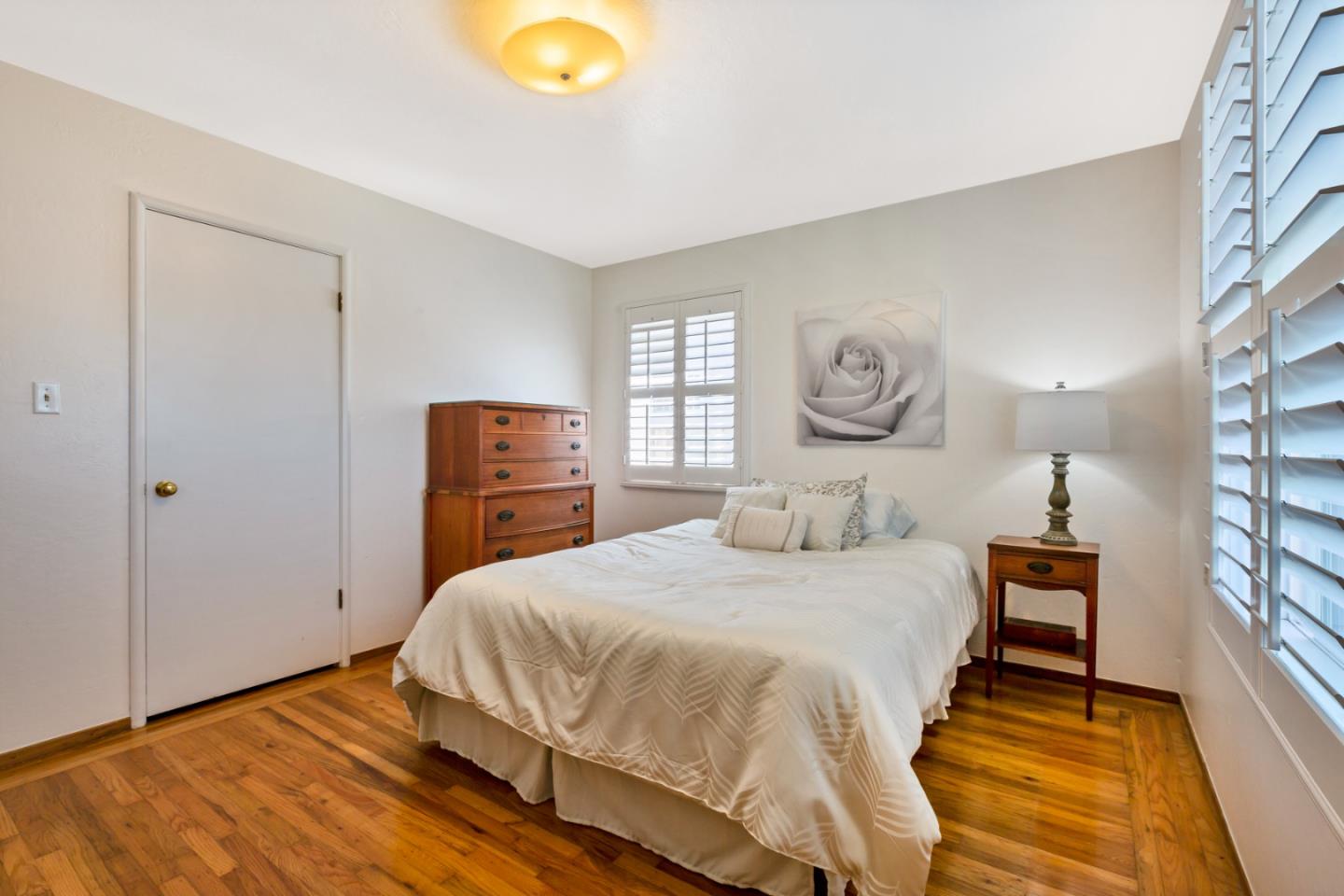 16 North Rochester Street San Mateo, CA 94401 - Photo 14 of 27 a bedroom with a bed and wooden floor