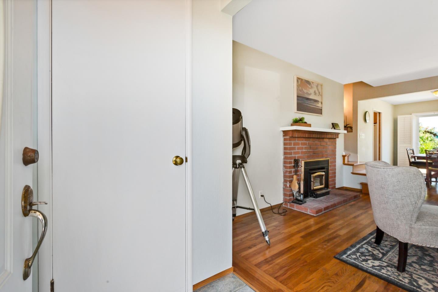 16 North Rochester Street San Mateo, CA 94401 - Photo 5 of 27 a living room with furniture a fireplace and a flat screen tv