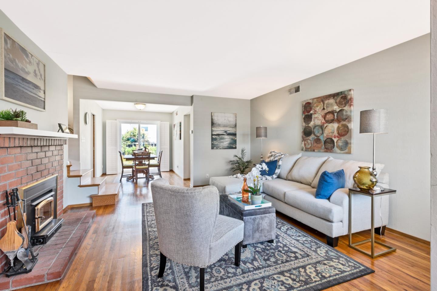 16 North Rochester Street San Mateo, CA 94401 - Photo 6 of 27 a living room with furniture and a fireplace