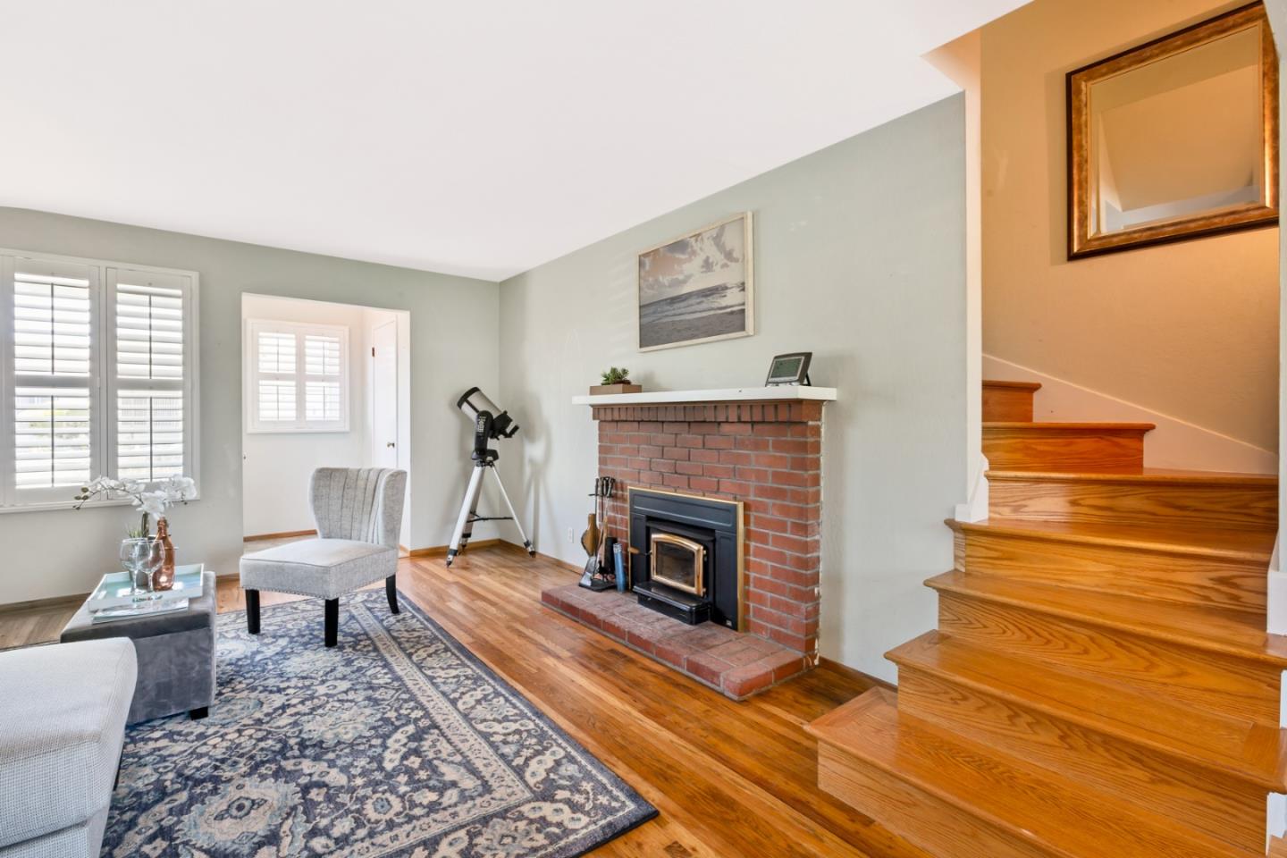 16 North Rochester Street San Mateo, CA 94401 - Photo 9 of 27 a living room with furniture and a fireplace