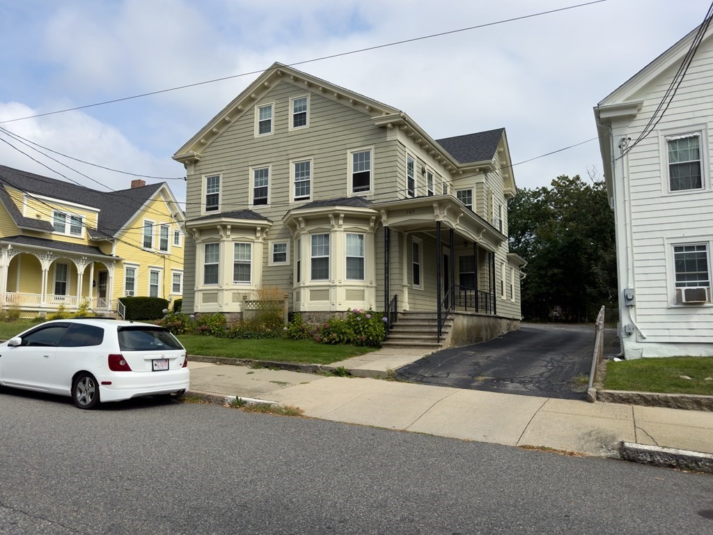 107-121 Winter Street Fall River, MA 02720 - Photo 2 of 10 a view of a car parked in front of a brick house
