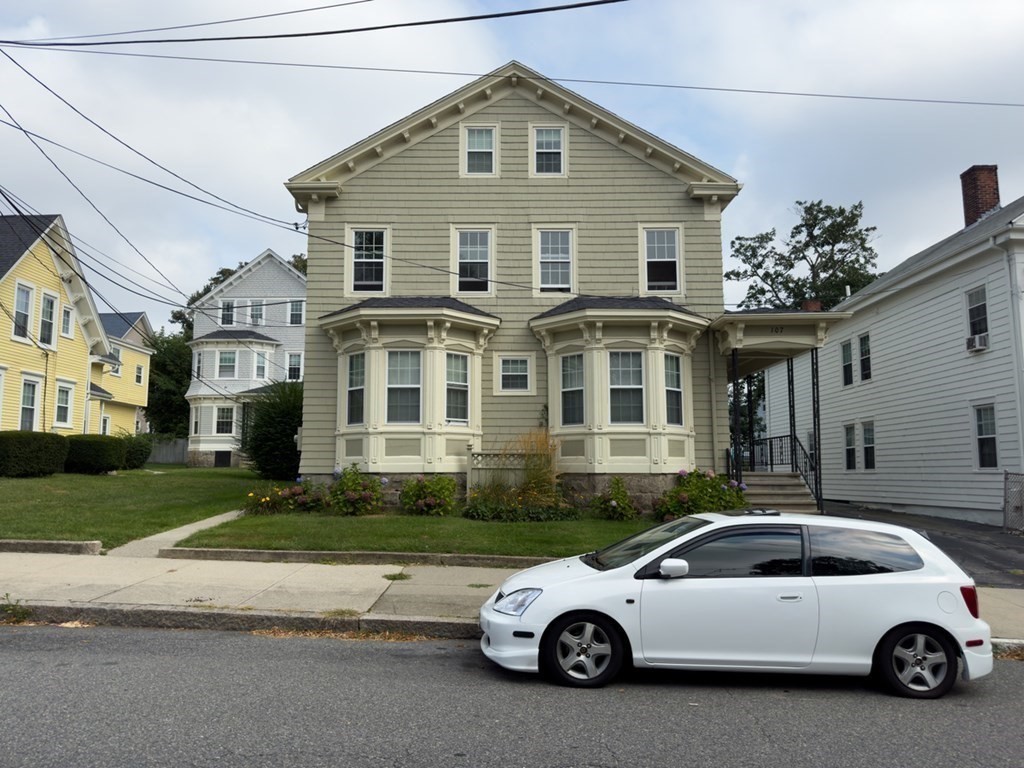 107-121 Winter Street Fall River, MA 02720 - Photo 3 of 10 a car parked in front of a house