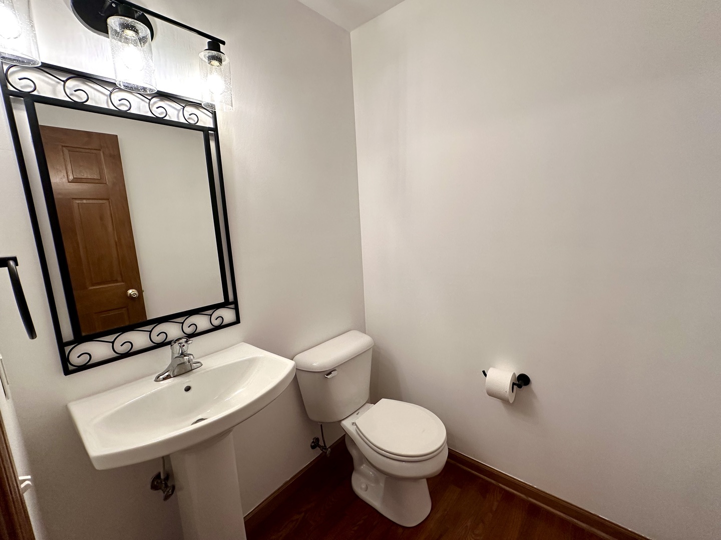 811 Water Stone Way Malta, IL 60150 - Photo 16 of 27 a bathroom with a toilet sink and mirror
