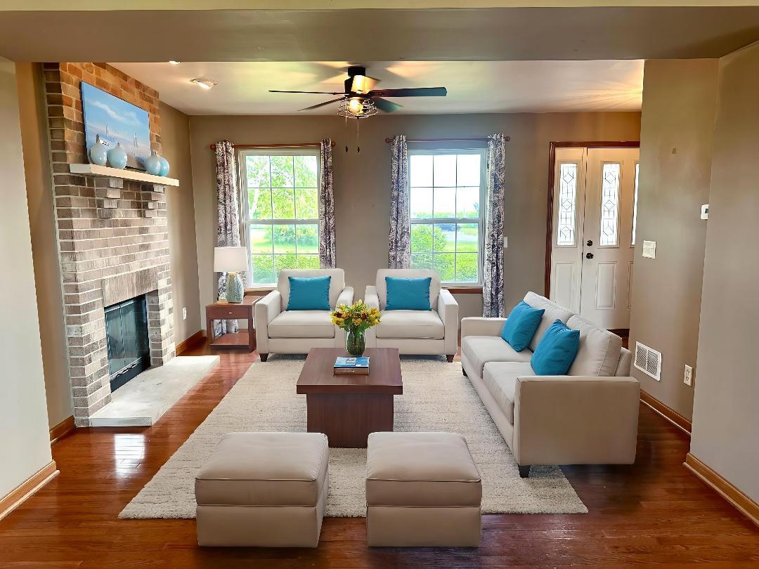 811 Water Stone Way Malta, IL 60150 - Photo 4 of 27 a living room with furniture and a fireplace