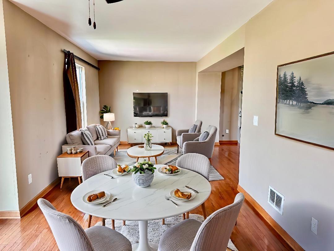 811 Water Stone Way Malta, IL 60150 - Photo 6 of 27 a living room with furniture and a flat screen tv