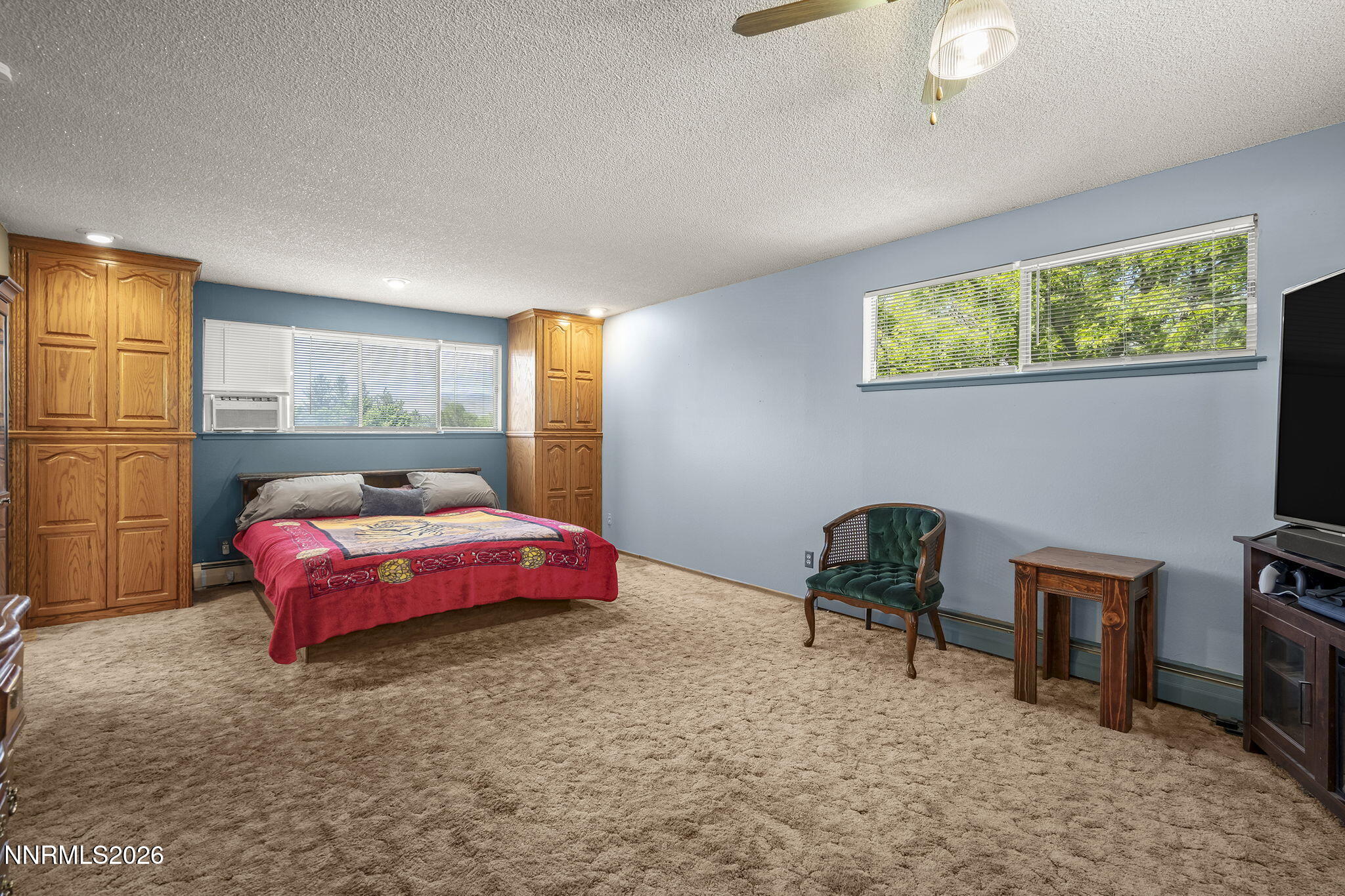 549 Ruby Lane Carson City, NV 89706 - Photo 17 of 37 a bedroom with a bed a table and chair