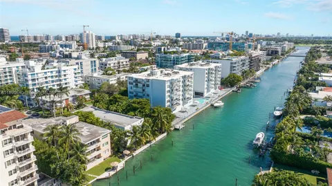 a picture of a park with a white on the side of a white house