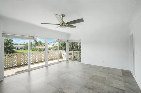 a view of an empty room with windows