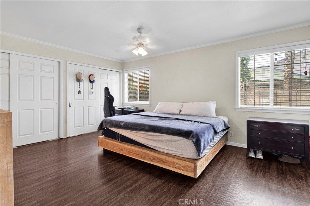 1087 Baseline Road La Verne, CA 91750 - Photo 21 of 39 a spacious bedroom with a bed and a dresser next to a window