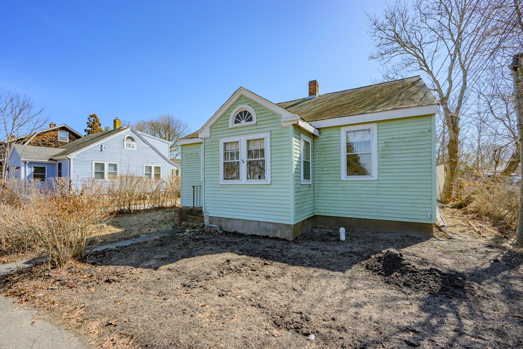 65 Louis Street Barnstable, MA 02601 - Photo 1 of 37 a front view of a house with a yard