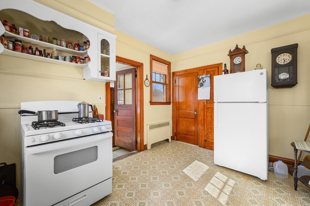 65 Louis Street Barnstable, MA 02601 - Photo 13 of 37 a kitchen with a refrigerator and a stove