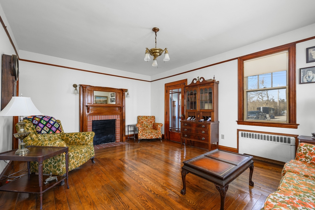 65 Louis Street Barnstable, MA 02601 - Photo 2 of 37 a living room with furniture and wooden floor
