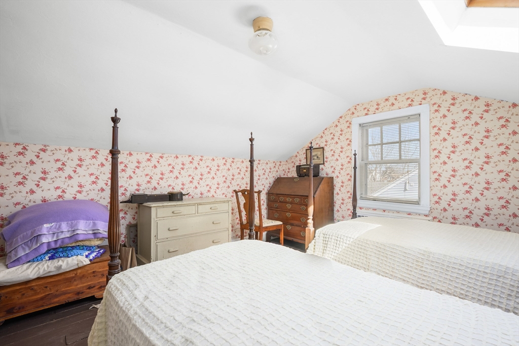 65 Louis Street Barnstable, MA 02601 - Photo 23 of 37 a bedroom with a bed and dresser with mirror