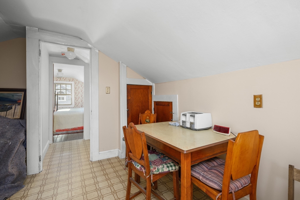 65 Louis Street Barnstable, MA 02601 - Photo 26 of 37 a view of a dining room with furniture and a chandelier