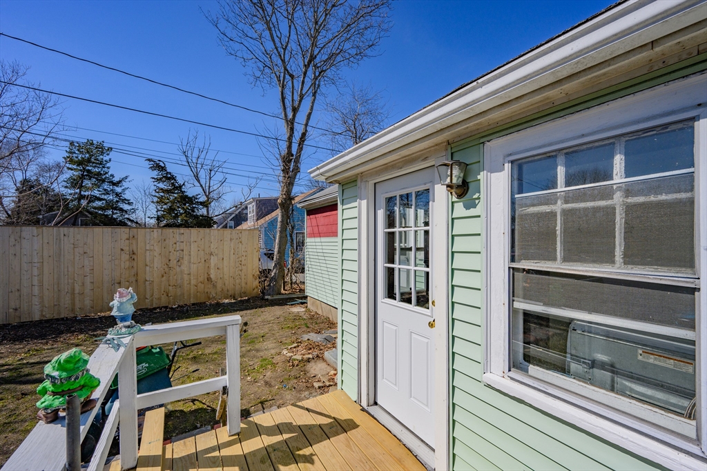 65 Louis Street Barnstable, MA 02601 - Photo 31 of 37 a front view of a house with a garden