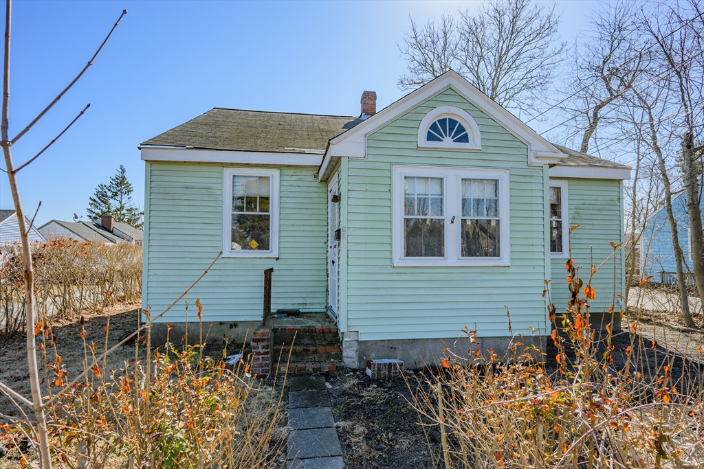 65 Louis Street Barnstable, MA 02601 - Photo 34 of 37 a front view of a house with garden