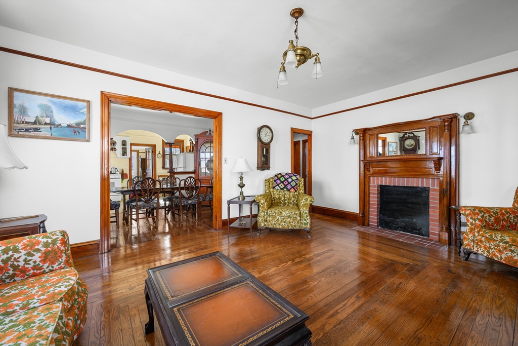 65 Louis Street Barnstable, MA 02601 - Photo 5 of 37 a living room with furniture and a fireplace