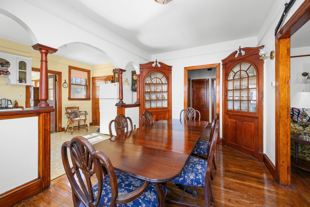 65 Louis Street Barnstable, MA 02601 - Photo 7 of 37 a dining room with furniture a chandelier and wooden floor