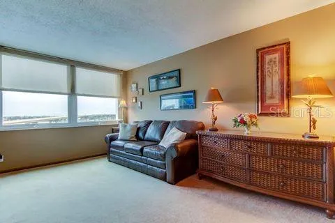 a view of hallway with furniture and a mirror