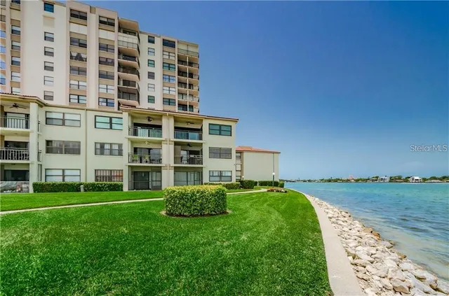 a view of a building with a yard