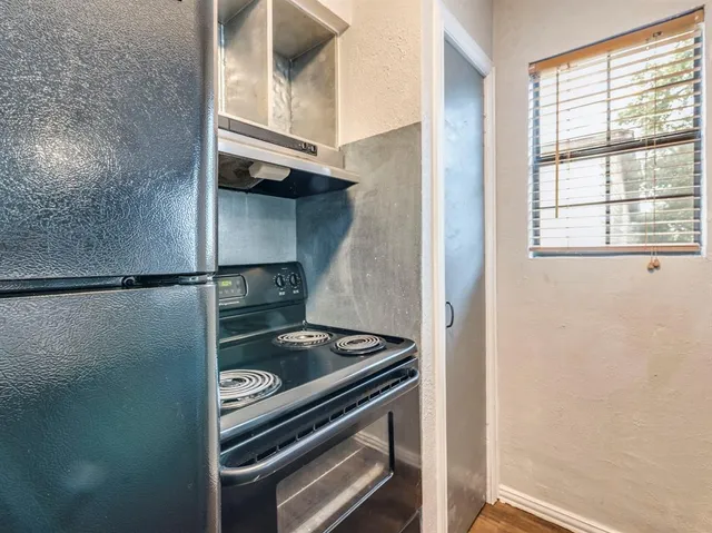 a kitchen with a stove and a microwave