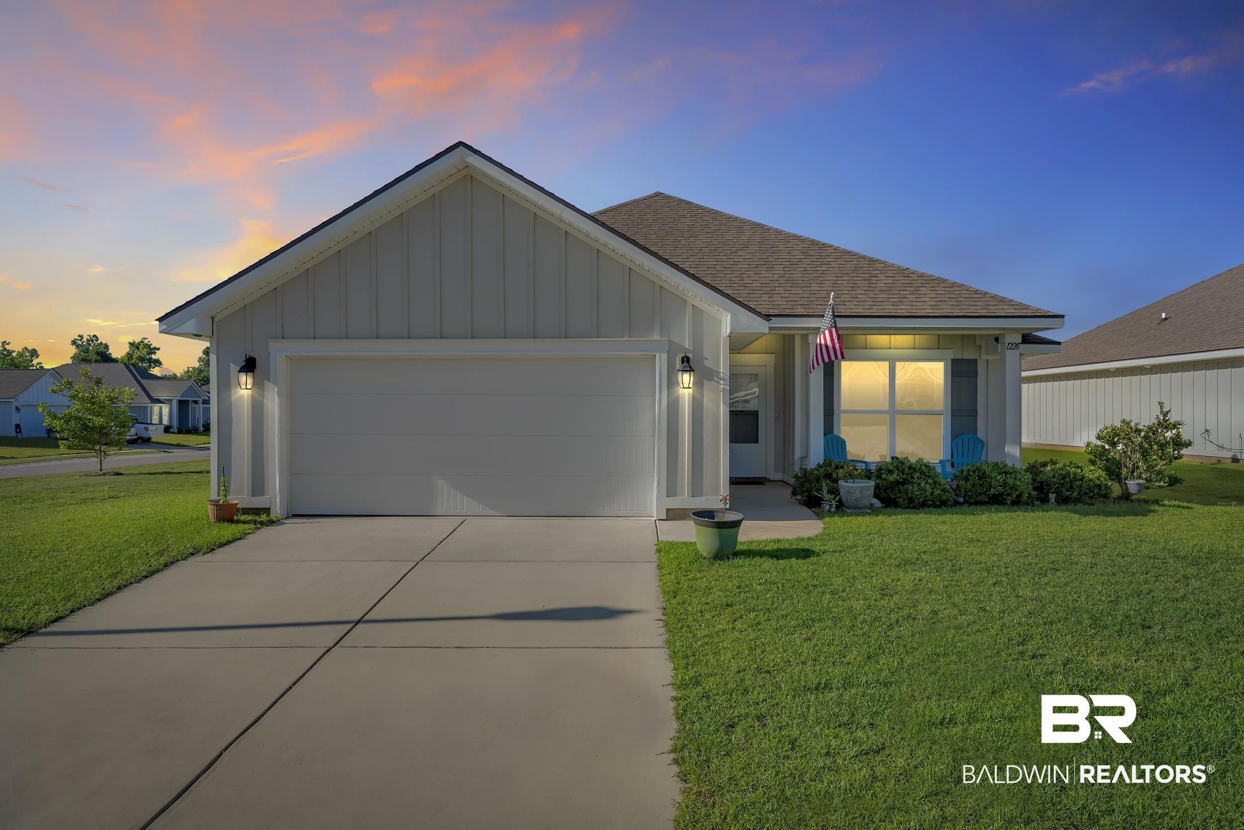1228 Caper Avenue Foley, AL 36535 - Photo 2 of 54 Single-story residence featuring light-colored vertical siding and a brown shingle roof
