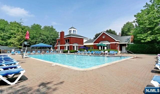 302 Stockton Court Edgewater, NJ 07020 - Photo 11 of 15 a front view of a house with yard