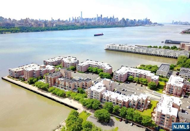 302 Stockton Court Edgewater, NJ 07020 - Photo 15 of 15 a view of a lake with a lake