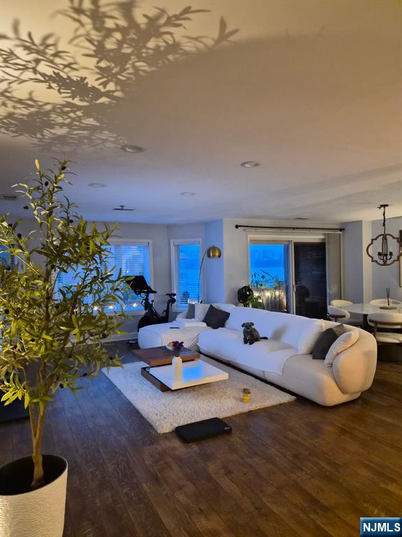 302 Stockton Court Edgewater, NJ 07020 - Photo 2 of 15 a living room with furniture a rug and a potted plant