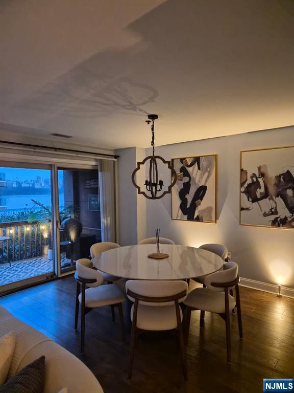 302 Stockton Court Edgewater, NJ 07020 - Photo 3 of 15 a view of a dining room with furniture and wooden floor