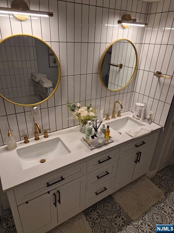 302 Stockton Court Edgewater, NJ 07020 - Photo 6 of 15 a bathroom with a sink and a mirror