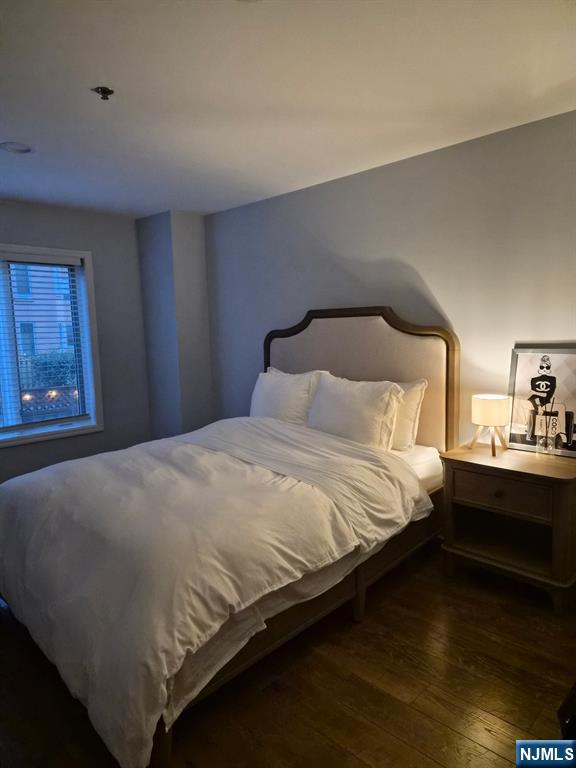 302 Stockton Court Edgewater, NJ 07020 - Photo 7 of 15 a bedroom with a bed and window