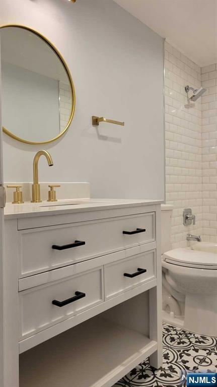 302 Stockton Court Edgewater, NJ 07020 - Photo 9 of 15 a bathroom with a sink mirror vanity and toilet