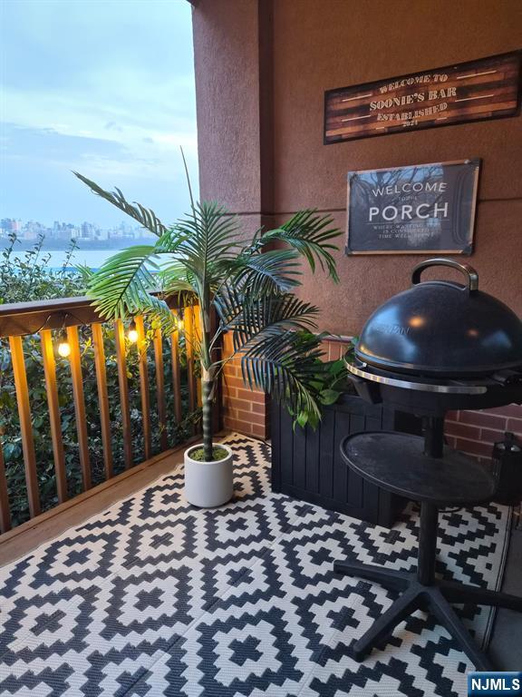 302 Stockton Court Edgewater, NJ 07020 - Photo 10 of 15 a view of a chairs and table in the patio