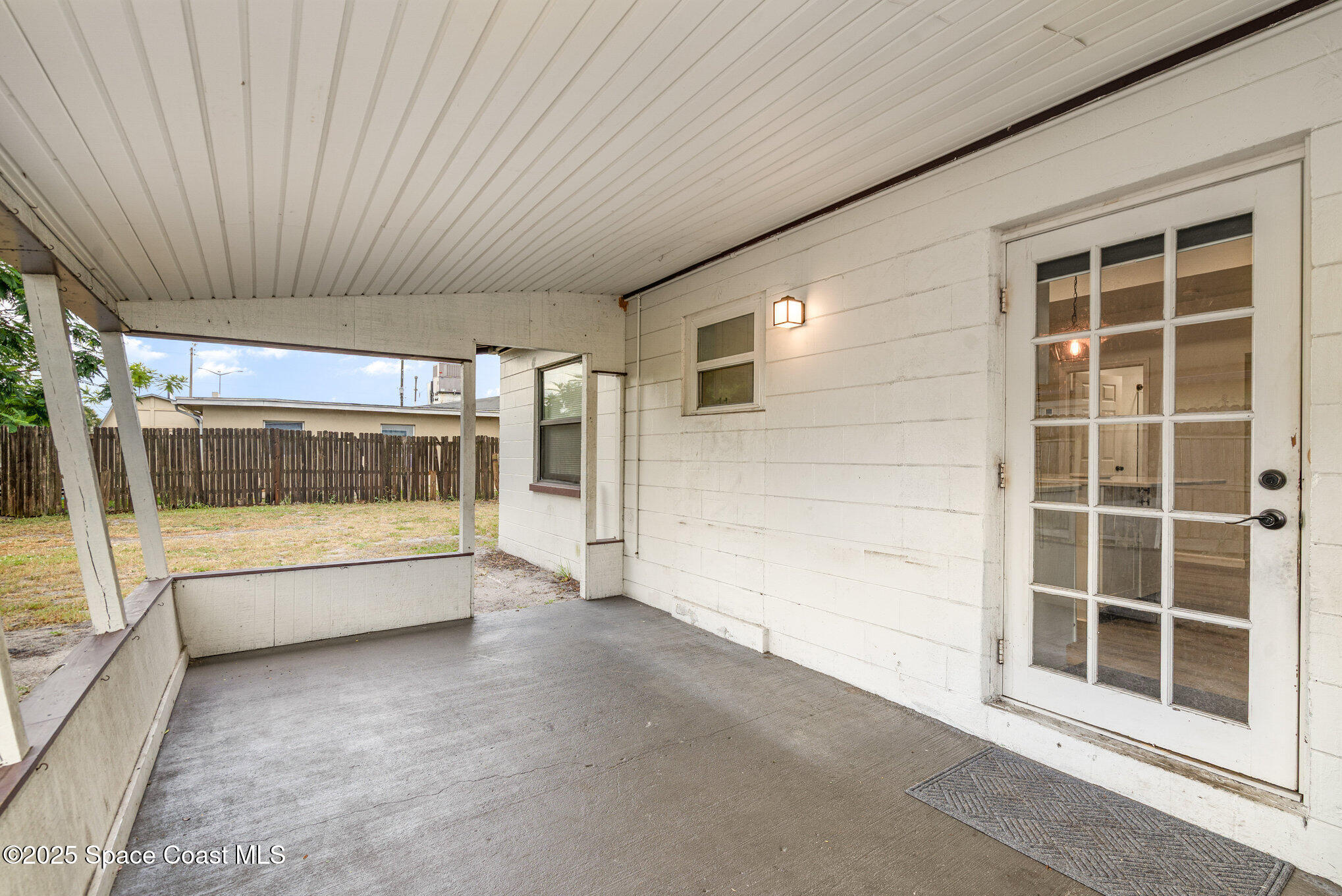 2158 Laden Road Melbourne, FL 32935 - Photo 5 of 19 a view of an empty room with a balcony
